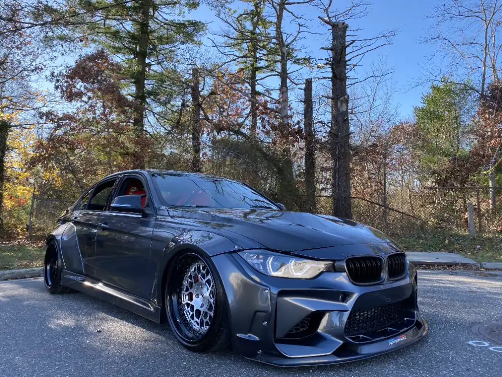 Gray widebody BMW M3 on bronze wheels