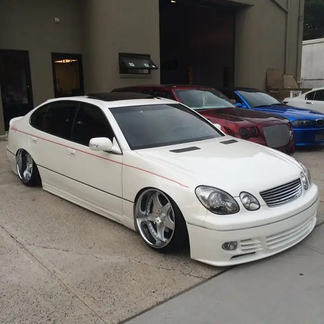 White Lexus GS parked in the shop lot