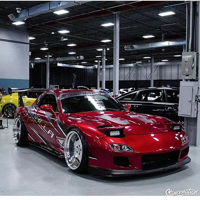 Red Mazda RX-7 at an indoor show